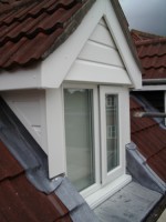 An example of replacement UPVC cladding and barge boards on a dormer window