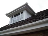 An example of replacement UPVC cladding and barge boards on a dormer window